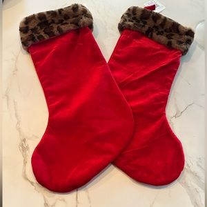 Two Ashland leopard Christmas stockings.
